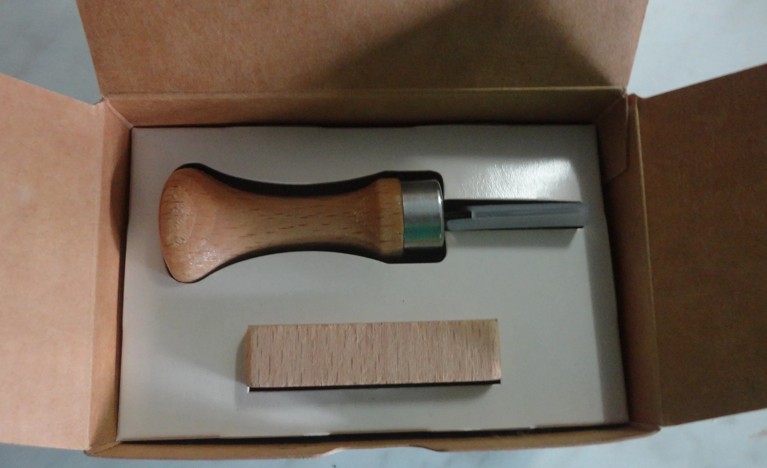 Buttonhole cutter with wooden block
